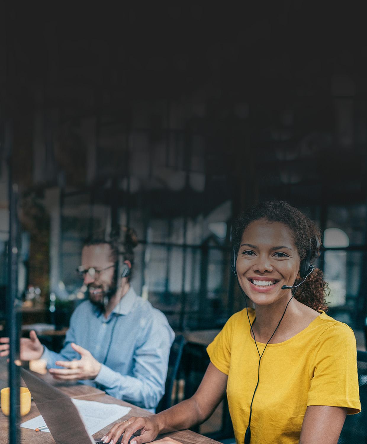 Stock photograph of a smiling woman wearing a headset.