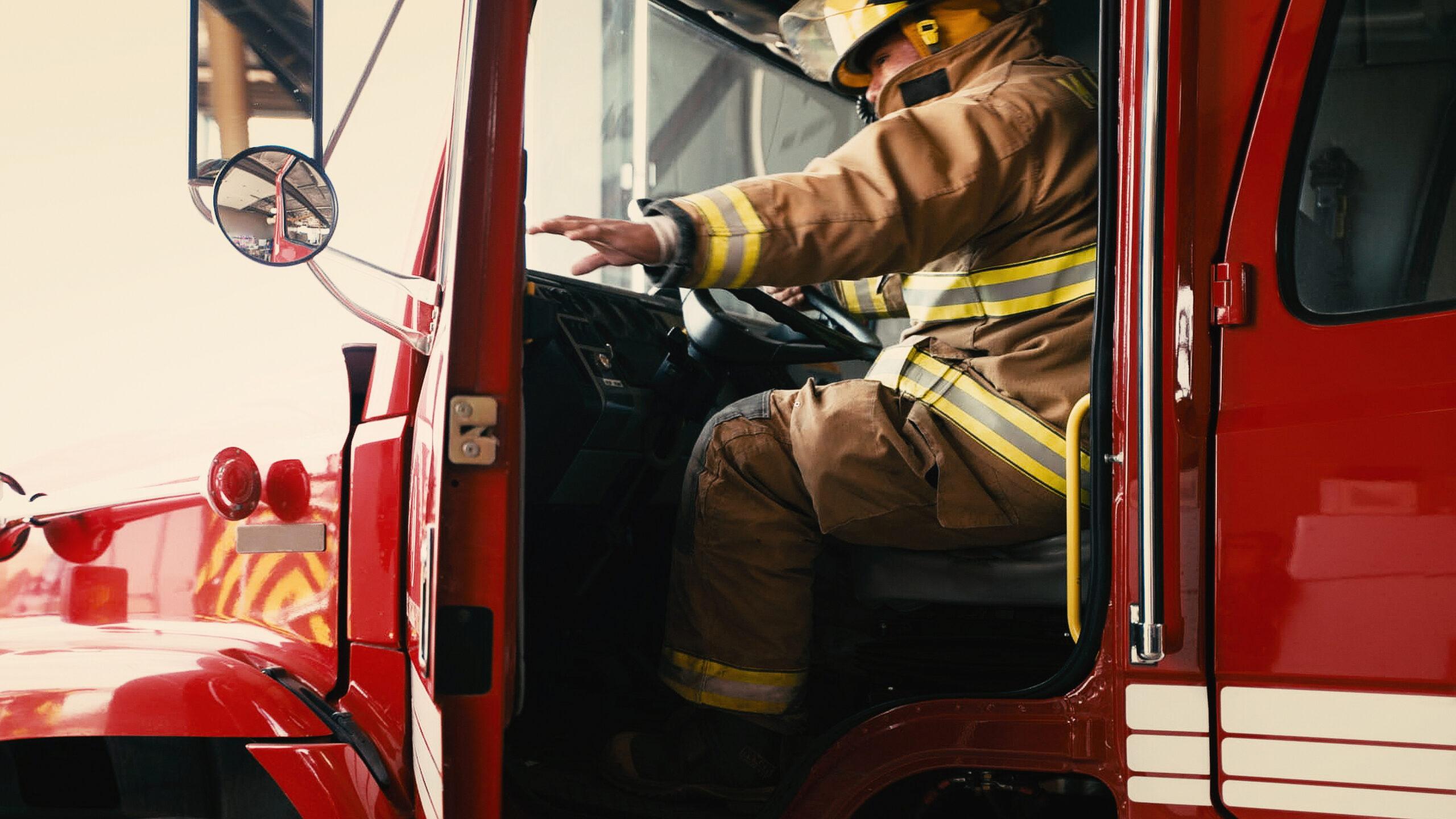firefighter getting in truck