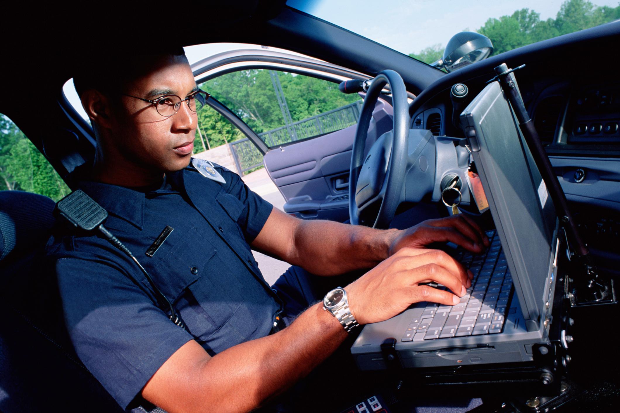 Police officer documenting incident information