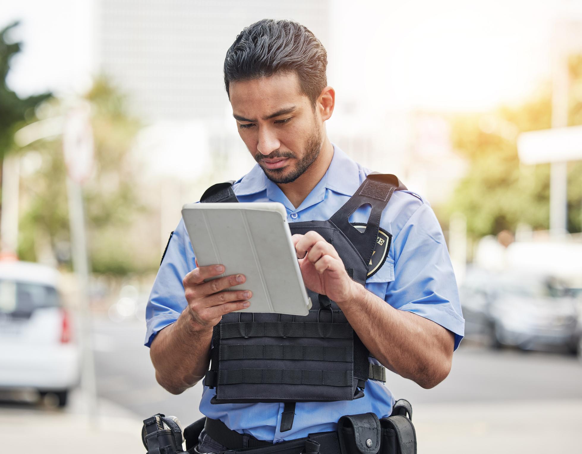 police officer on mobile CAD device