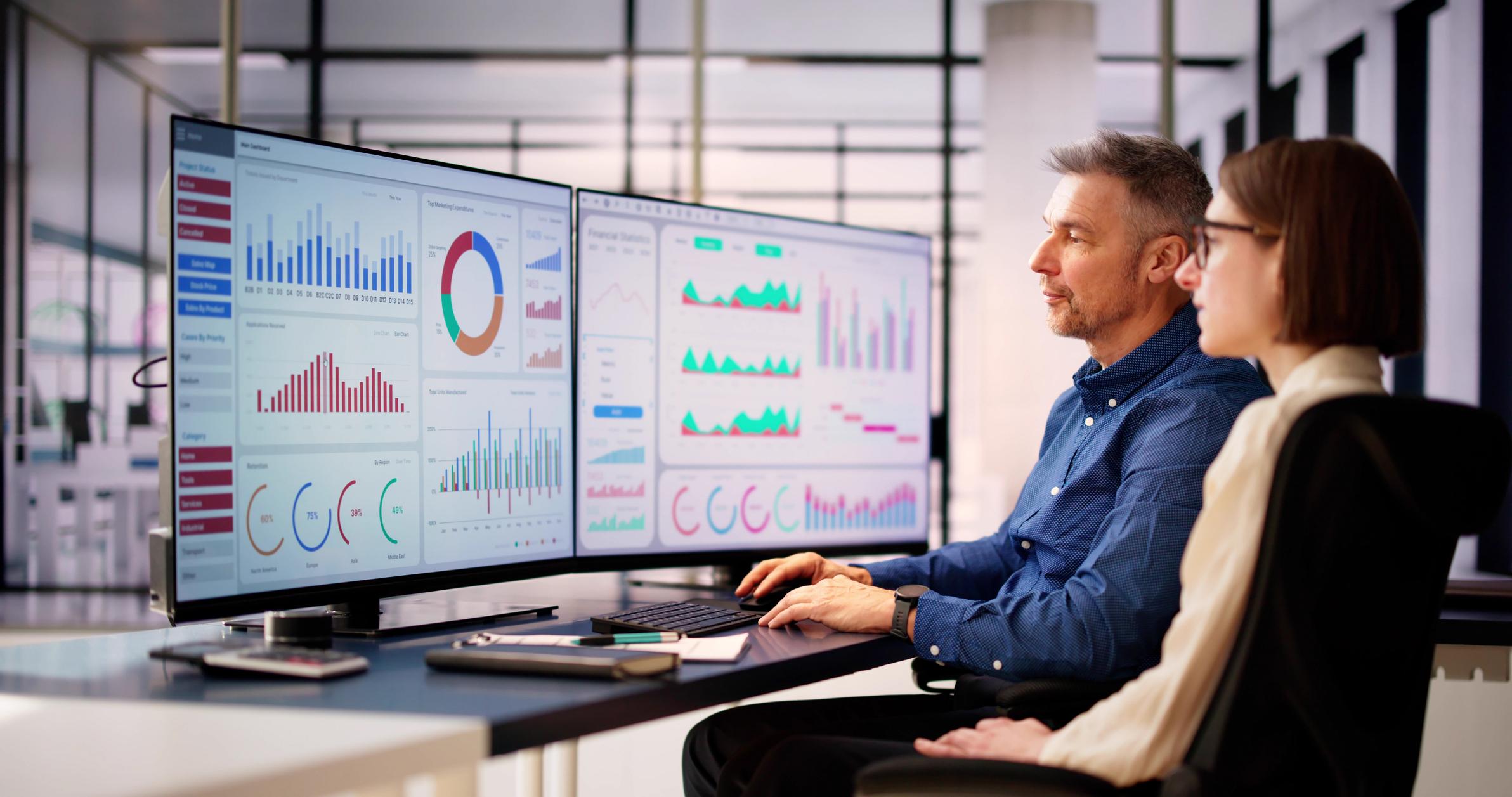 man and woman using data analytics for public sector disaster recovery