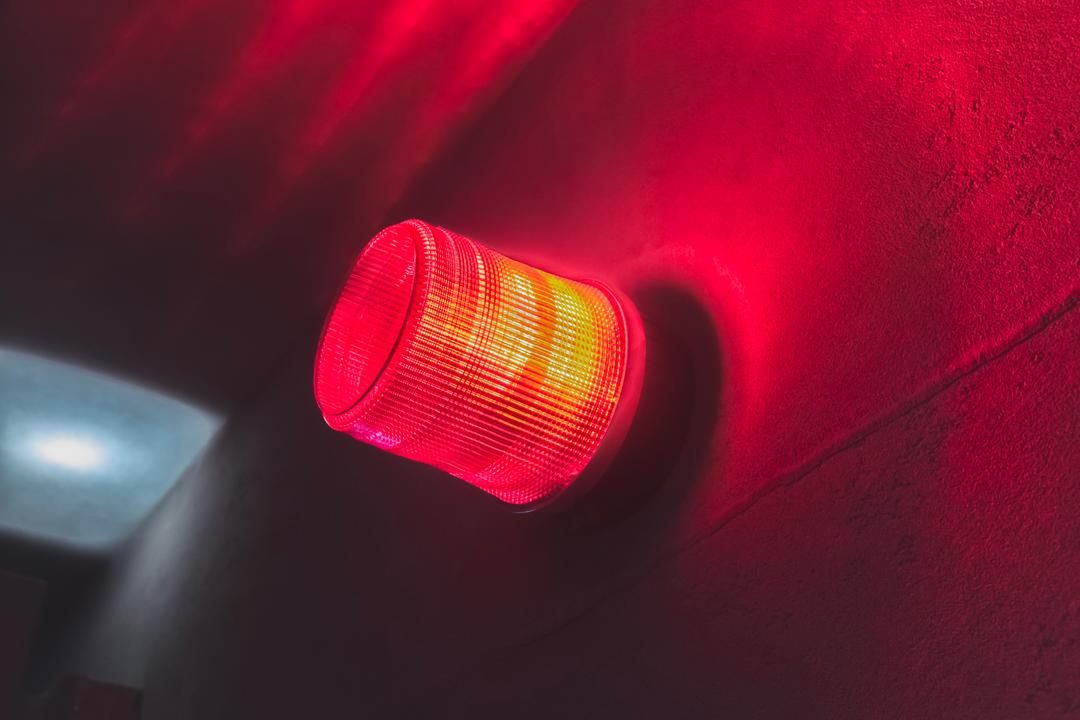 Wall mounted alarm activated with red warning light