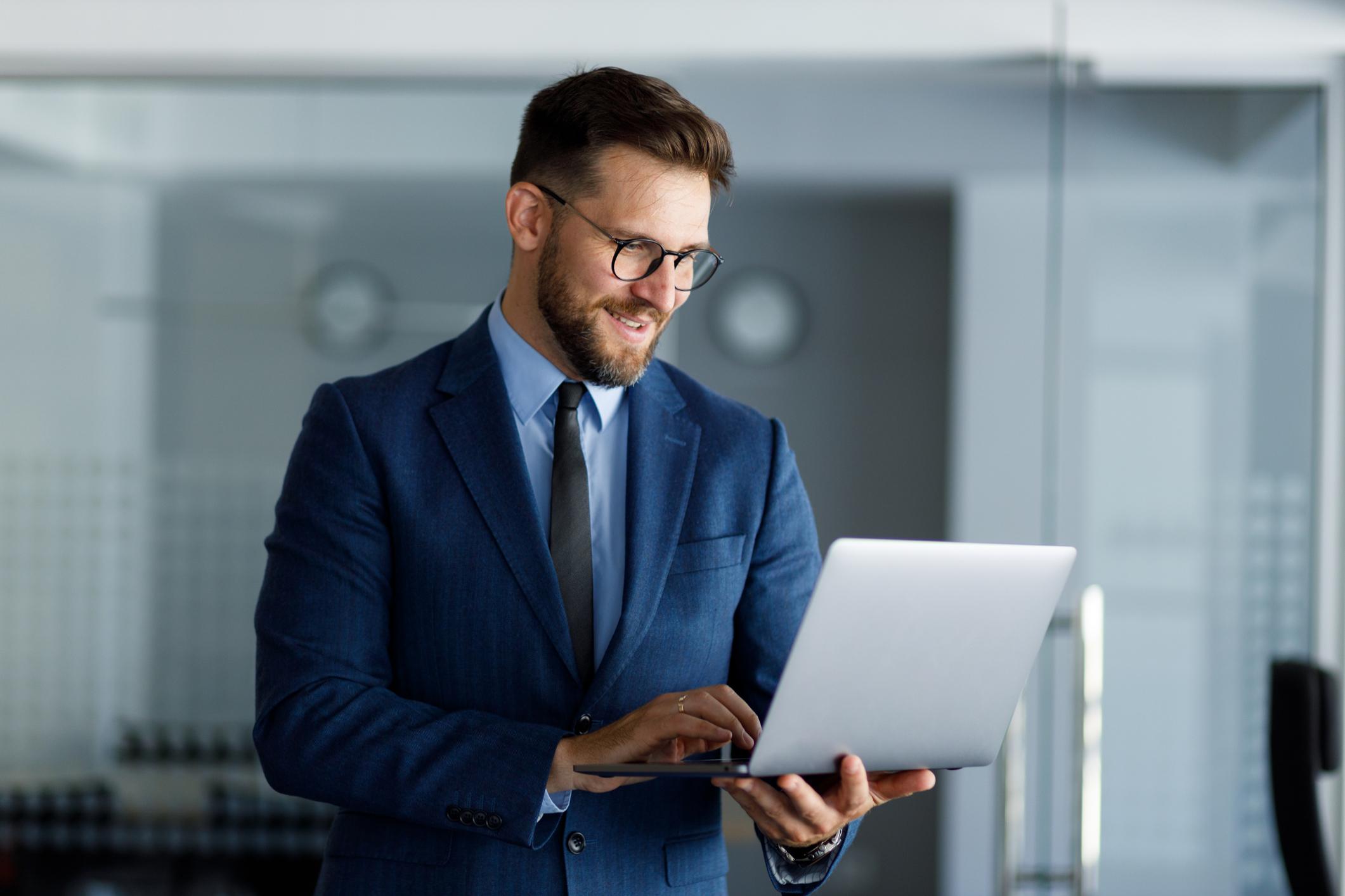 Businessman working on a laptop in an office,