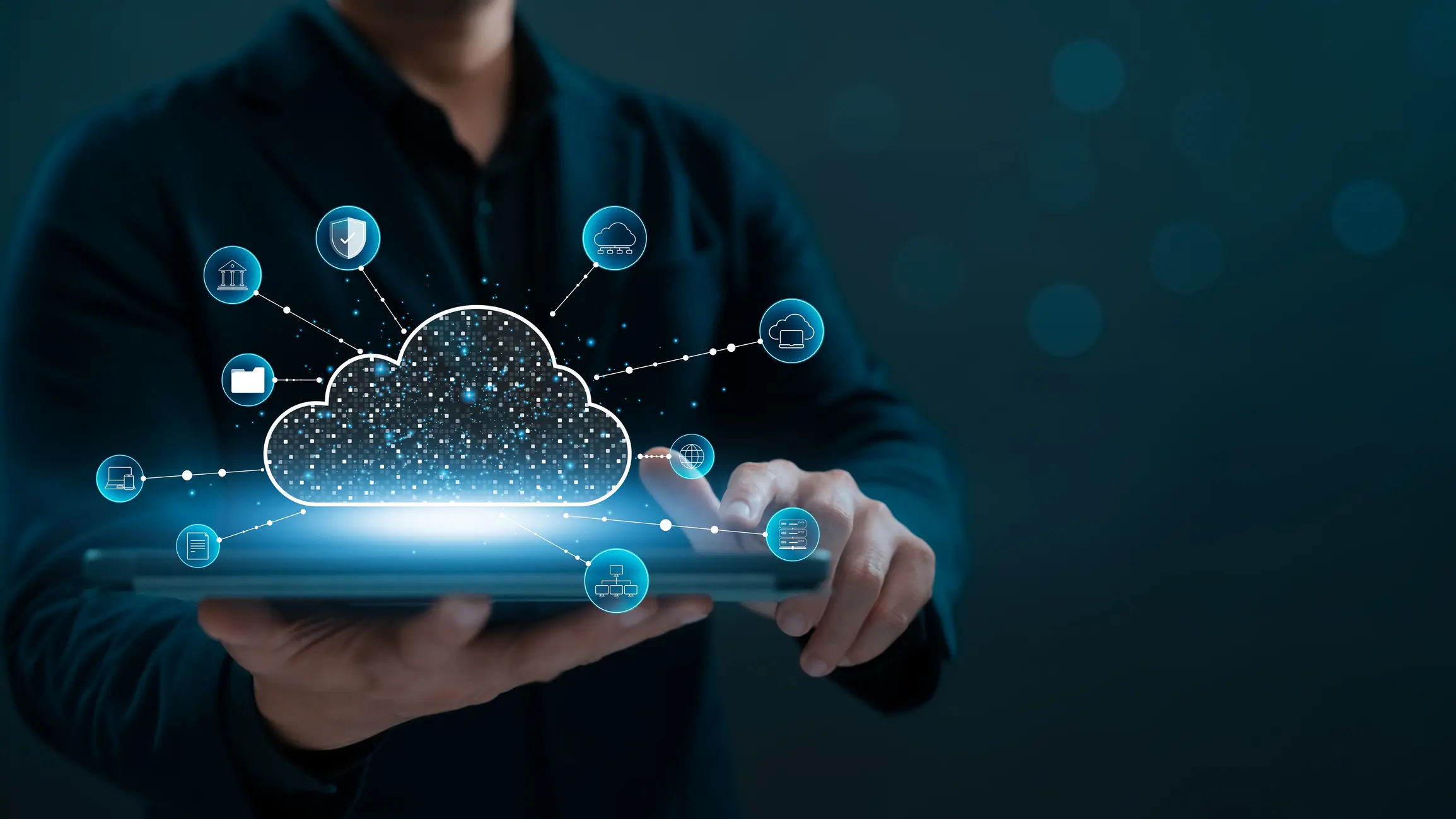 A person holding a tablet with a projection of cloud computer technology